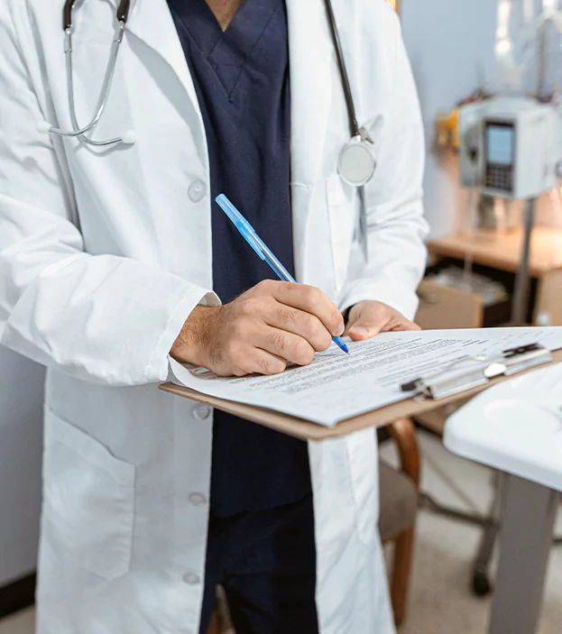 Doctor writting down on a notebook